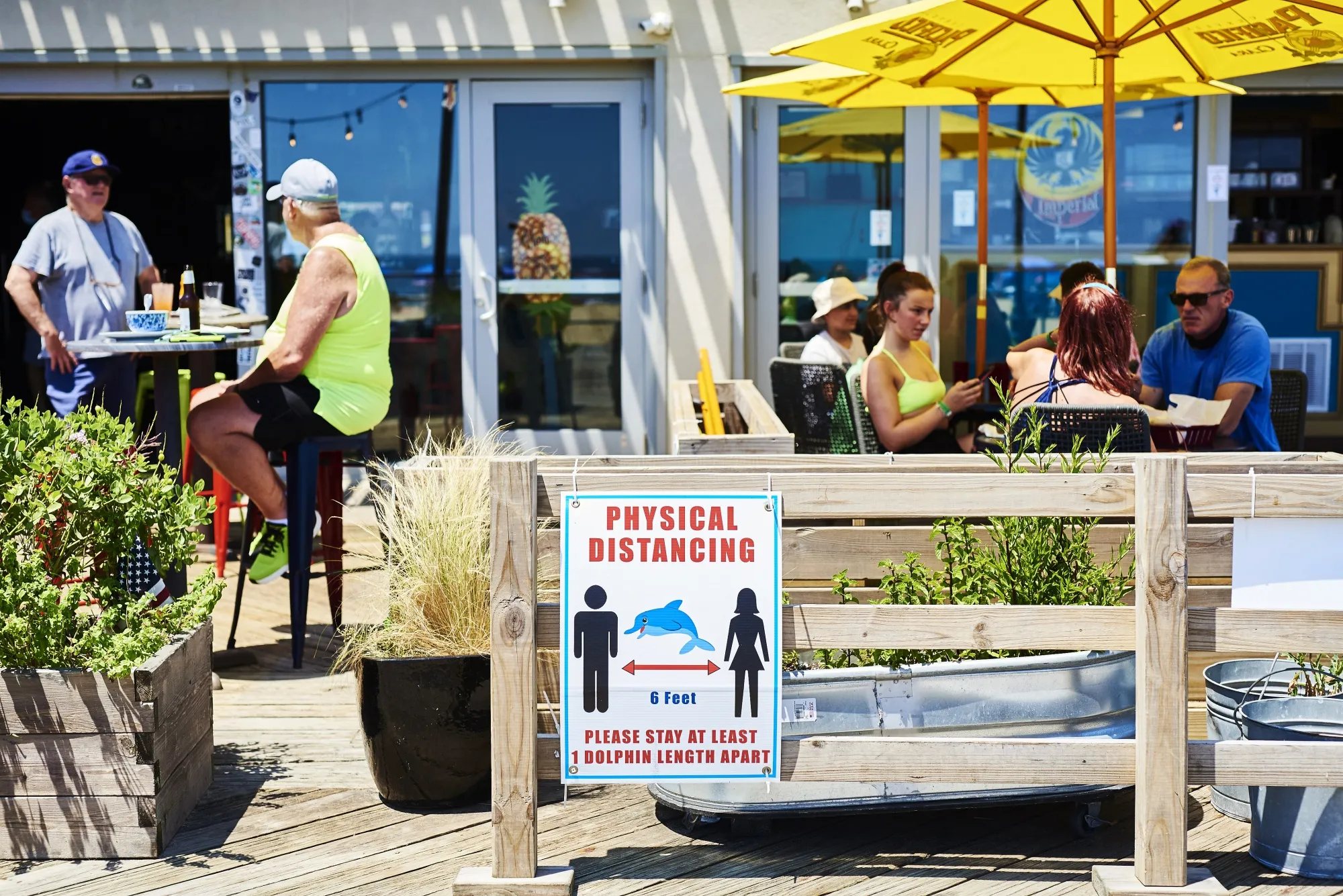 A social distancing sign is displayed on the boardwalk in Asbury Park, New Jersey, on July 9.
