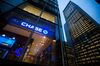 JPMorgan Chase & Co. signage is displayed at a bank branch, left, across from its Park Avenue headquarters, right, in New York, U.S., on Tuesday, Jan. 12, 2016. JPMorgan Chase is scheduled to release earnings data on January 14.
