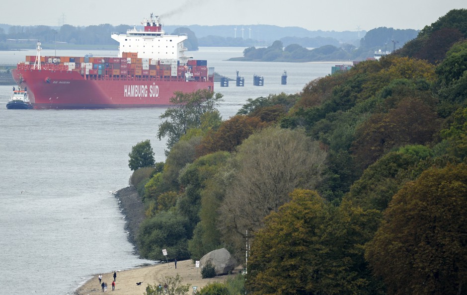 Container ships navigating the Elbe upstream from Hamburg