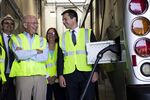 Congressman Peter DeFazio, a Democrat from Oregon, second left, with U.S. Transportation Secretary Pete Buttigieg, right, as they tour electric buses in Eugene, Oregon, in July 14, 2021. DeFazio has been championing greener transportation options since the 1990s.&nbsp;