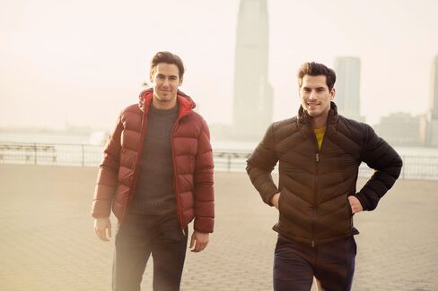 On Moore: (Here) Down jacket by Moncler via Mr Porter ($1,230); sweater by Bonobos ($108). (Above) Peacoat by Ermenegildo Zegna ($3,495); sweater by Ermenegildo Zegna ($1,295); jeans by Joe's Jeans (Moore's own). On Henrique: (Here) Down jacket by Z Zegna ($1,095); sweater by Z Zegna ($445). (Above) Coat by Theory ($1,295); shirt by Theory ($195); pants by AG Jeans ($178).