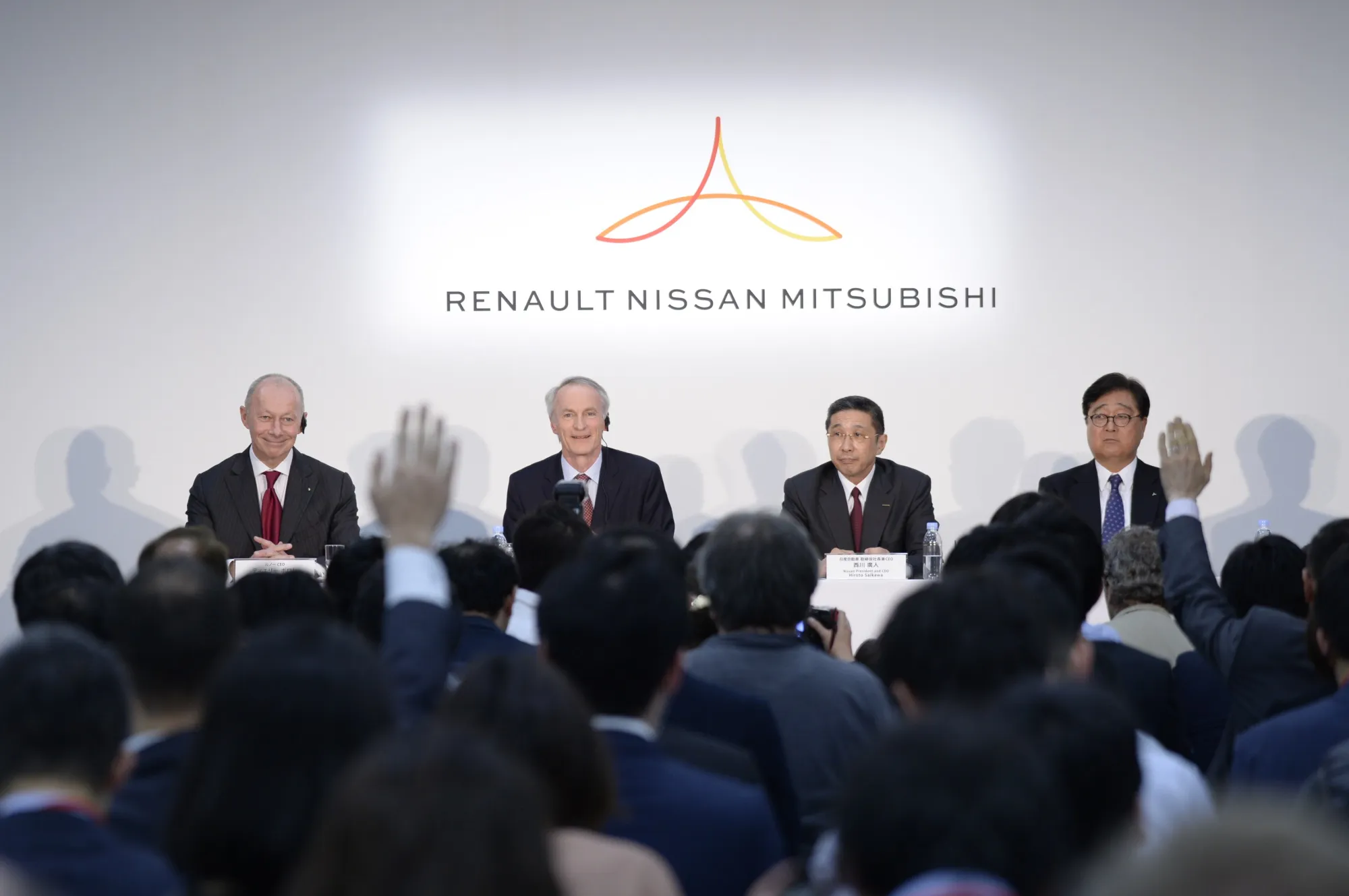 Thierry Bollore, Jean-Dominique Senard, Hiroto Saikawa, and Osamu Masuko in Tokyo on March 12.