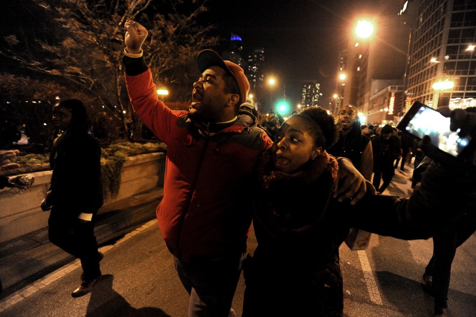 Protesters march during a protest, Tuesday, Nov. 24, 2015, in Chicago, for 17-year-old Laquan McDonald, who was fatally shot and killed by police in October 2014. 