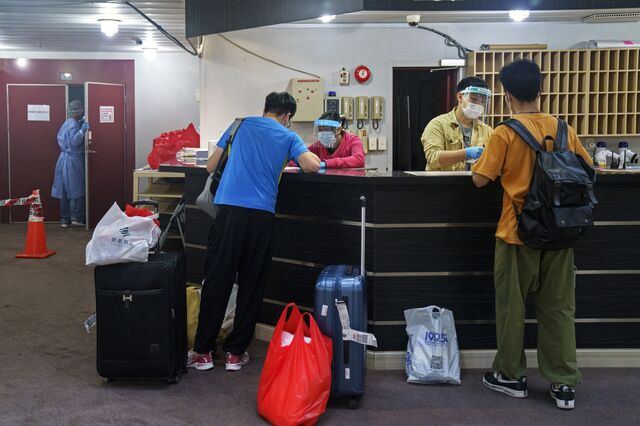 Crew members check in ahead of their deployment on a bulk carrier. Seafarers come from China, India, the Philippines and elsewhere to meet their ships.  