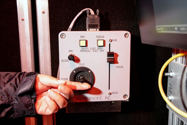 An MBARI researcher controls the camera on the MiniROV from the control room.