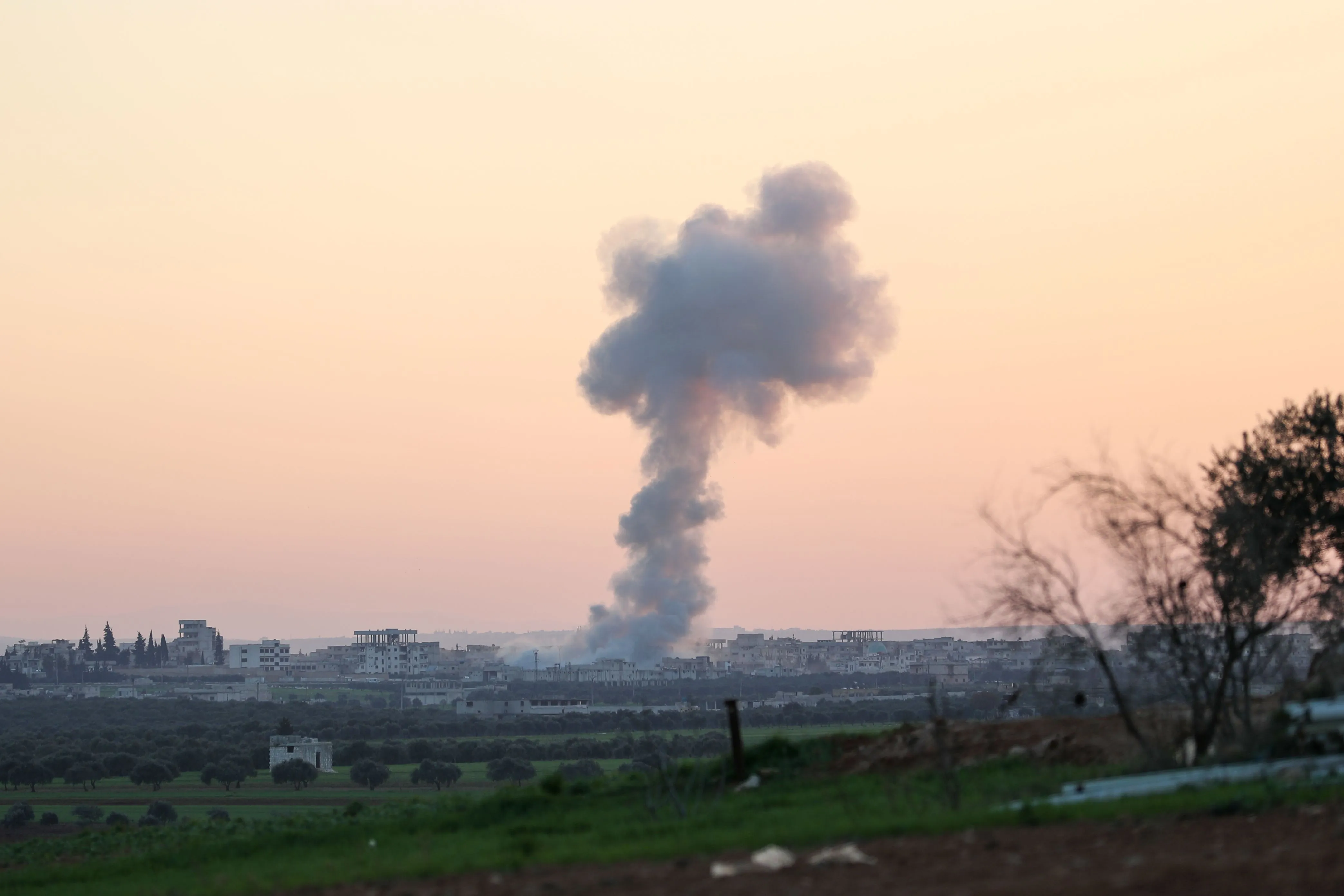 Smoke billows above the rebel-controlled village of Sarmin in Idlib province on March 3.