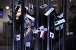 Attendees inspect a Sony Xperia XZ3 smartphone display at the Sony Corp.