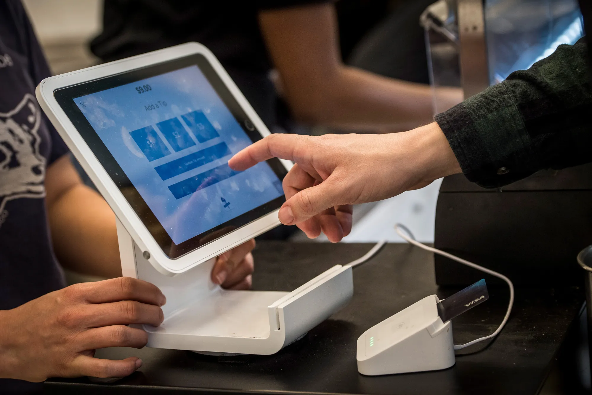 A customer uses a Square Inc. device to make a payment in San Francisco.