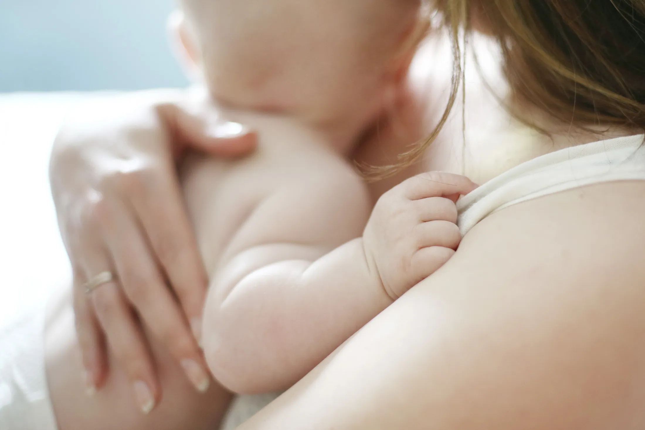 A baby in the arms of his mum