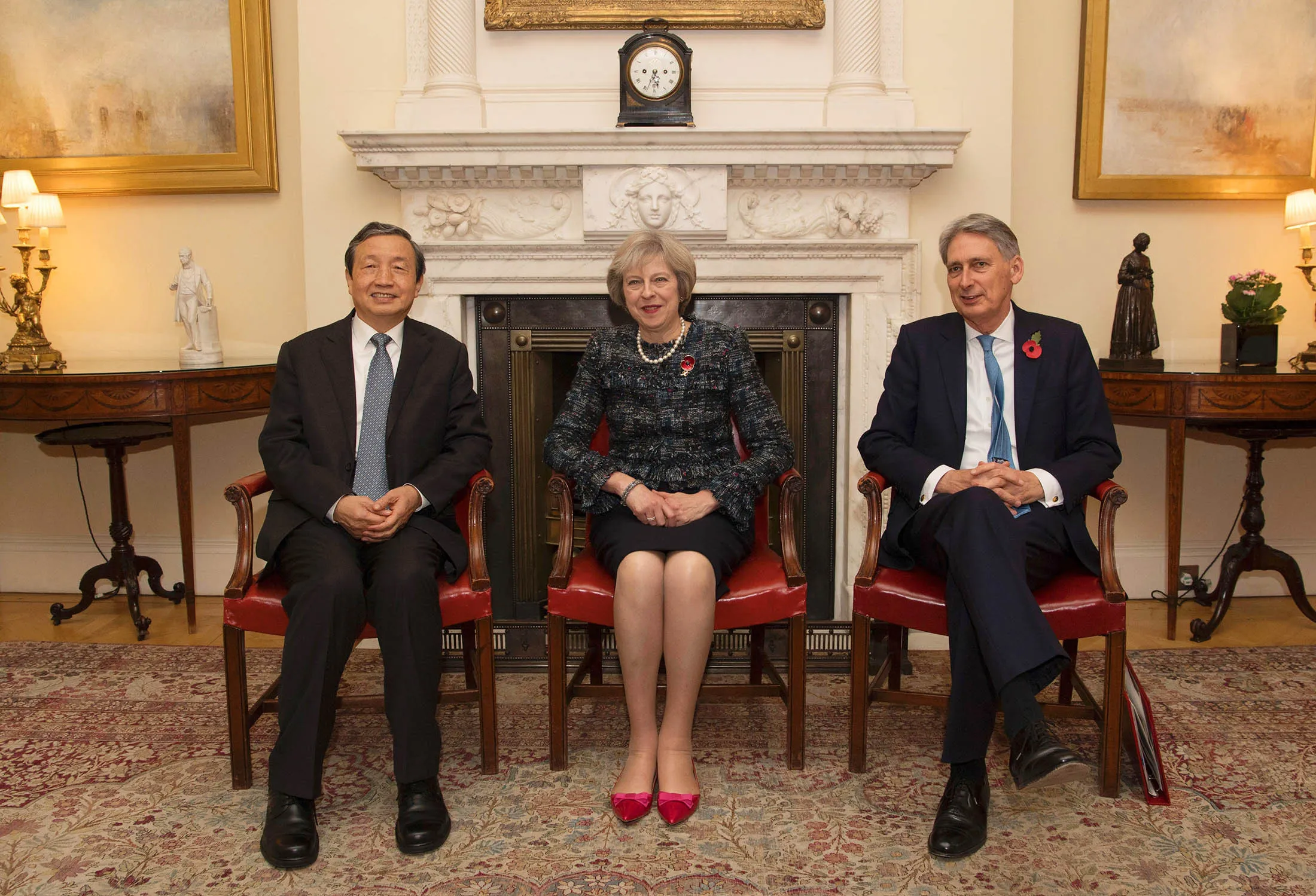 Theresa May, Philip Hammond and Ma Kai in London on Nov. 9.
