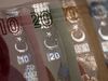 Star and Cresent symbols sit on an assortment of Turkish Lira banknotes in this arranged photograph in London, U.K., on Wednesday, Aug. 15, 2018. Turkey took its boldest steps yet to try to ward off a financial crisis by making it harder for traders to bet against the battered lira and easing rules on restructuring troubled loans that have already topped $20 billion.