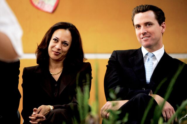 Kamala Harris and Gavin Newsom watch students perform at a San Francisco school in 2004.