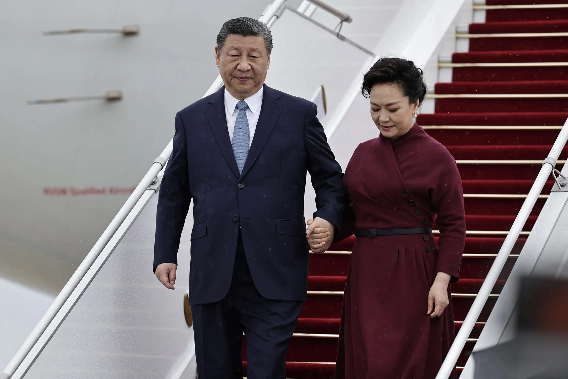 Xi Jinping and his wife Peng Liyuan arrive for an official two-day state visit at Orly airport, south of Paris on May 5.