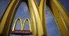 Signage stands outside a McDonald's Corp. fast food restaurant in Bowling Green, Kentucky, U.S.