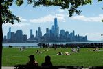 Sunbathers in Hoboken, New Jersey, enjoying the Lower Manhattan skyline