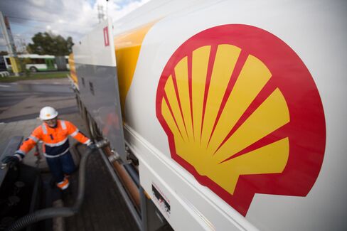 A fuel tanker truck delivers petrol to a gas station operated by Royal Dutch Shell Plc in Moscow, Russia, on Sept. 30, 2014.