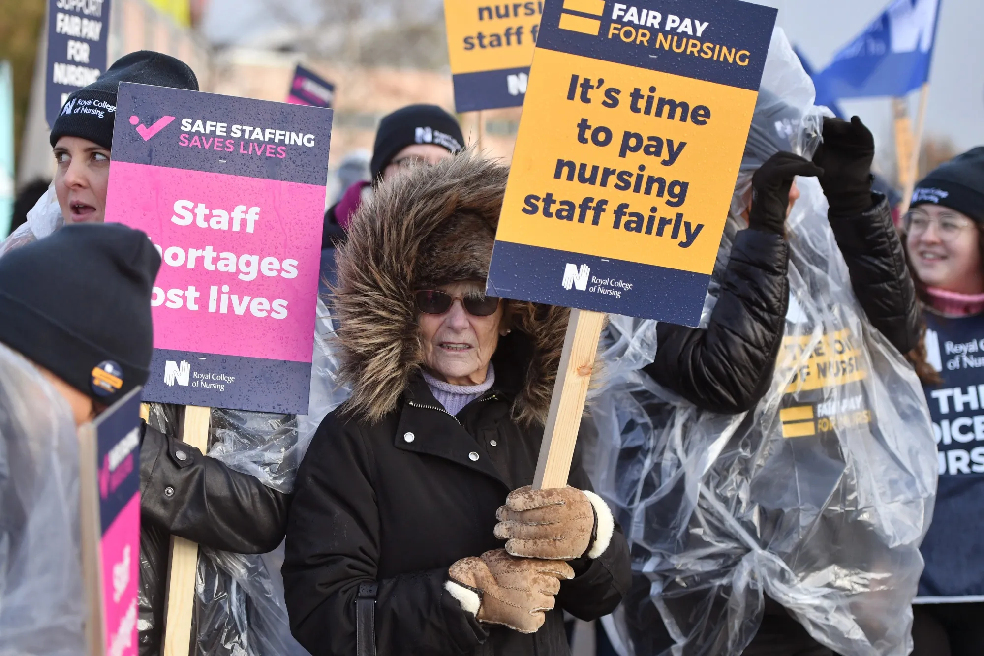 Demonstrators on a picket line during an NHS nursing staff strike in Liverpool.