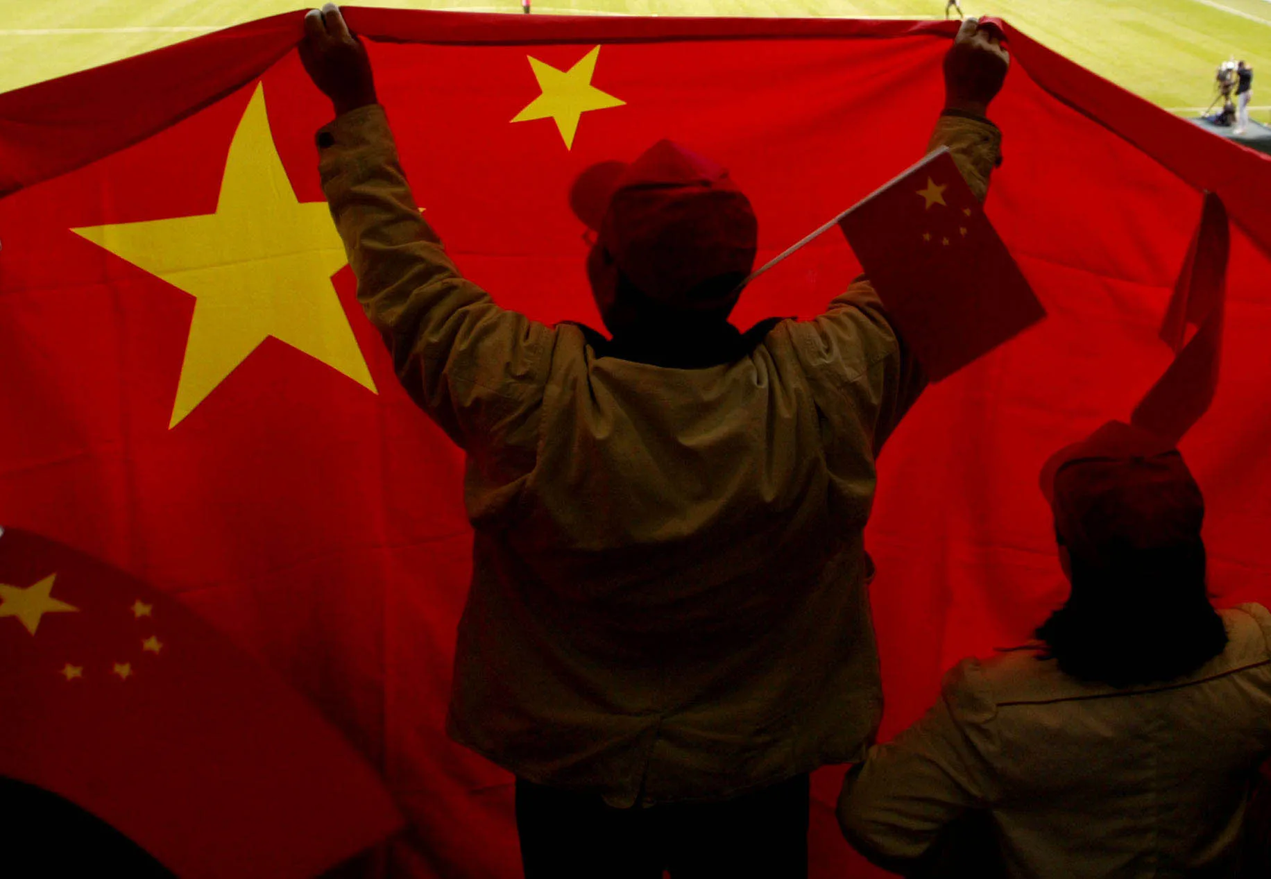 China fans cheer on their team against Canada at PGE Park in Portland, Oregon, October 2, 2003. Canada defeated China 1-0 in The 2003 Women's World Cup Quarterfinal. (Photo by Tom Hauck/Getty Images)