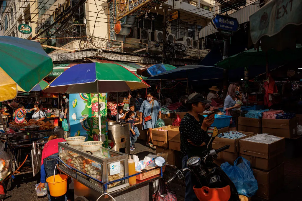 Shoppers at a market in Bangkok.