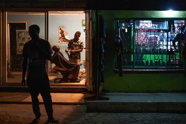 A man gets a shave in a barbershop in Kazungula town, Zambia.