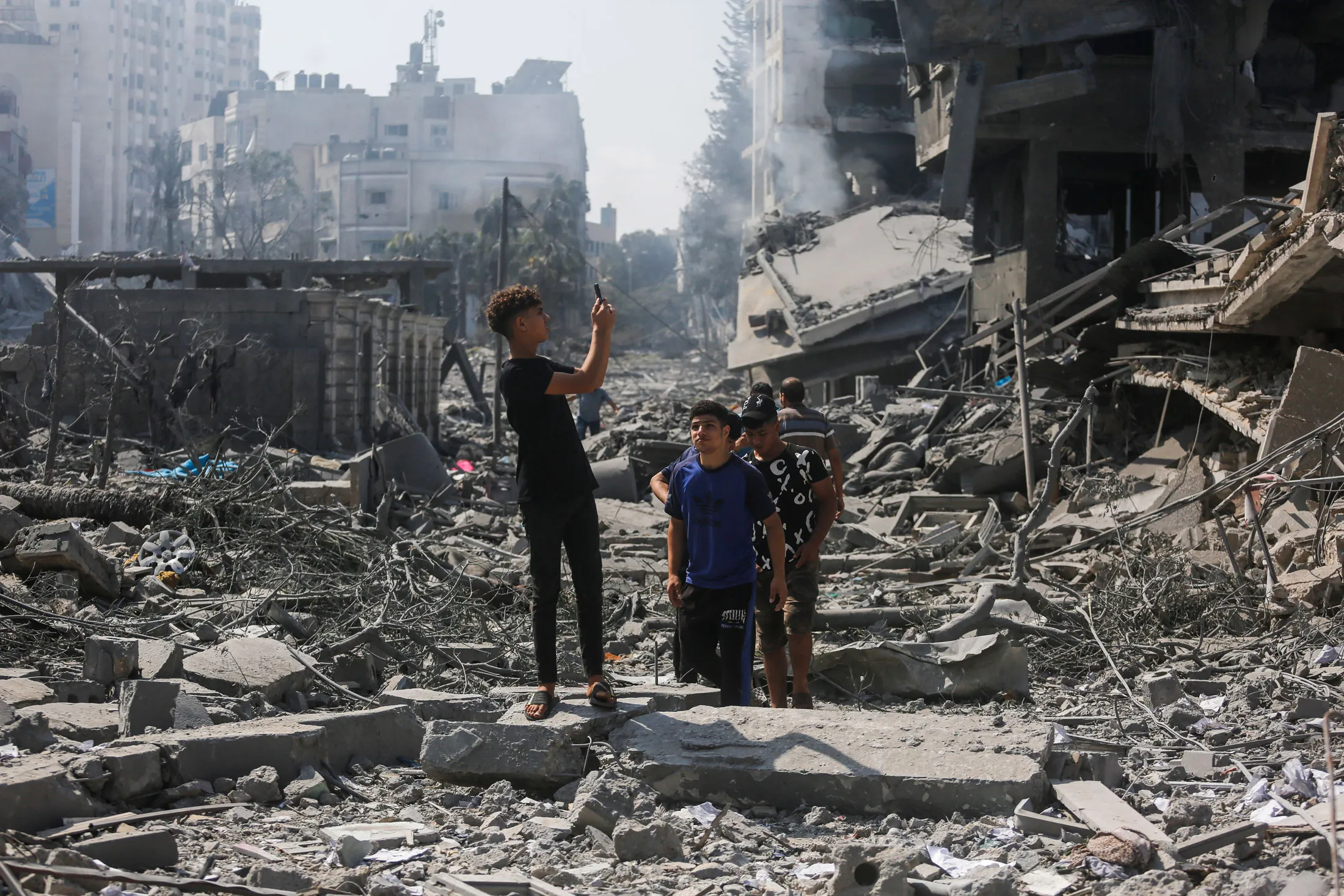 Palestinians on the rubble of destroyed buildings after&nbsp;Israeli airstrikes in Gaza City&nbsp;on Oct.&nbsp;10.
