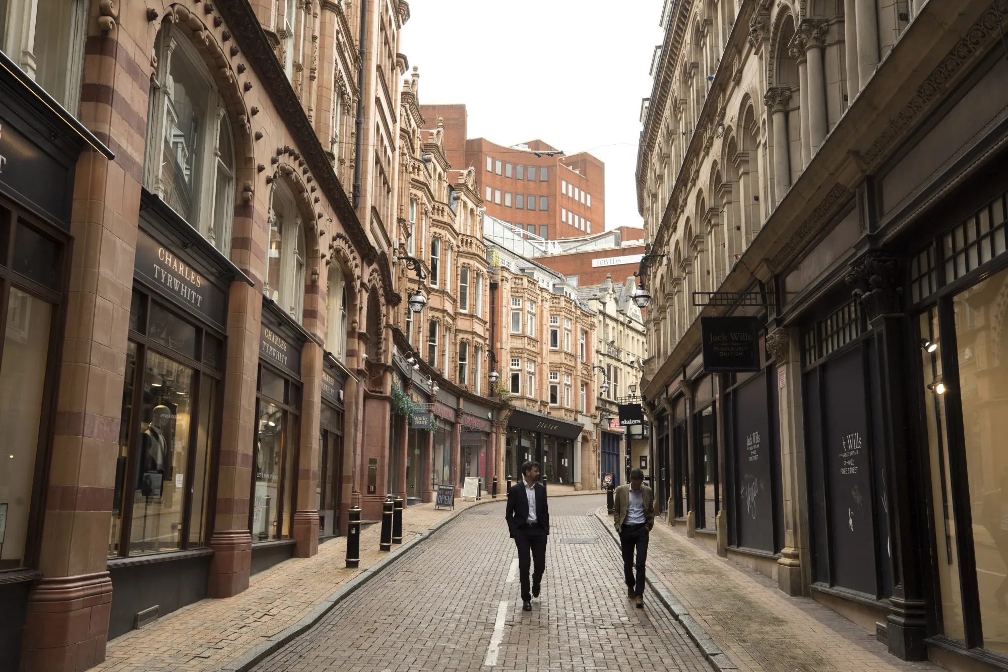 Pedestrians walk along a shopping precinct in Birmingham, U.K., on&nbsp;Sept. 4.