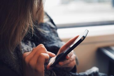 Close-Up Of Woman Using Mobile Phone