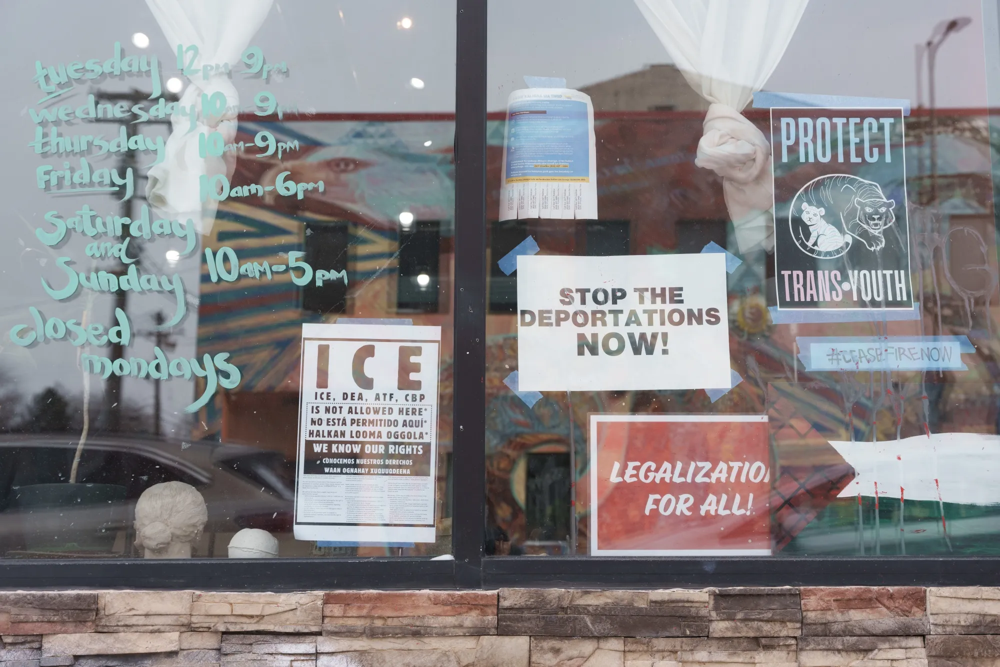 Signage regarding ICE&nbsp;deployment in the window of a business in Minneapolis on Jan. 22.&nbsp;