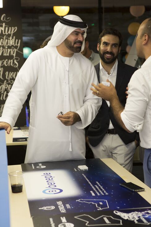 HE Mohammed Al Gergawi, U.A.E. Minister of Cabinet Affairs, speaking to AstroLabs member Tarig El Sheikh and Muhammed Mekki, co-founder of AstroLabs.