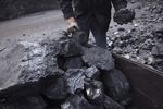 A worker sorts coal in Shanxi Province, China.