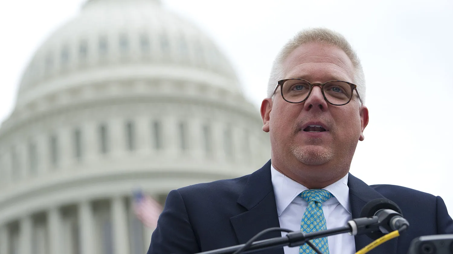 Conservative radio and television commentator Glenn Beck speaks to a rally of Tea Party members as they protest against the Internal Revenue Service (IRS) targeting of the Tea Party and similar groups during a rally called 'Audit the IRS' outside the US Capitol in Washington, DC, June 19, 2013.
