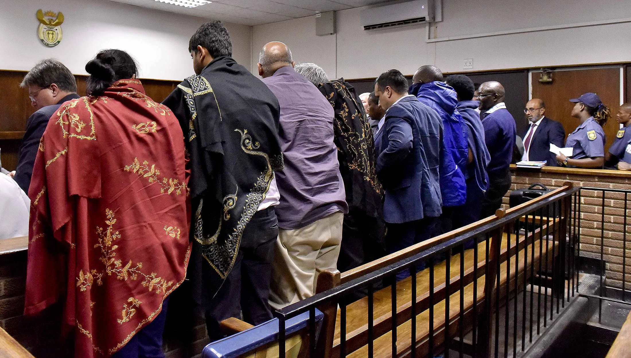 Suspects, including a Gupta family member, sit in the dock where they appeared at a&nbsp;court in Bloemfonten, South Africa on Feb. 15, 2018.&nbsp;