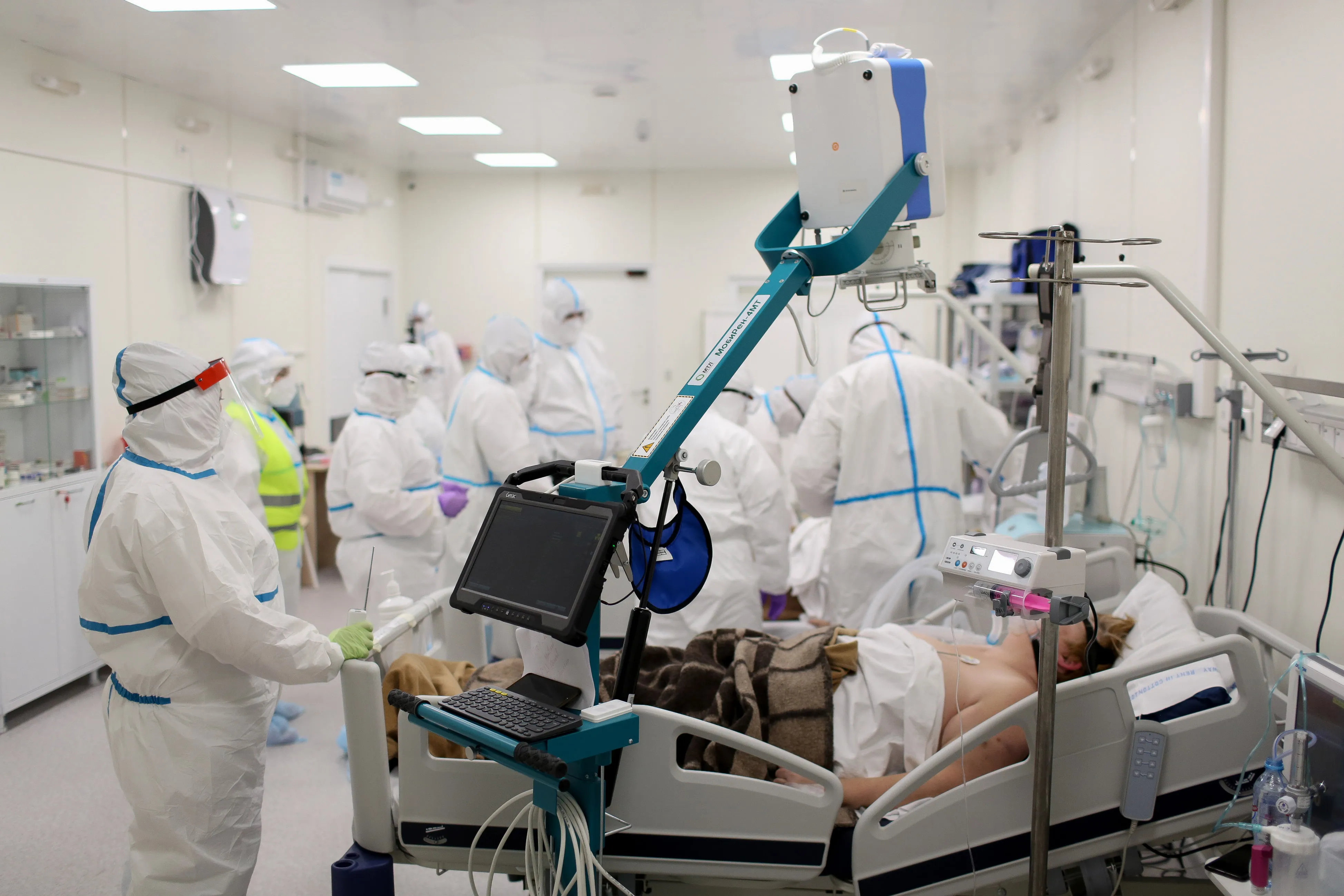 Medical workers treat a patient inside a temporary Covid-19 hospital in Moscow.