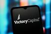In this photo illustration, the Victory Capital Holdings