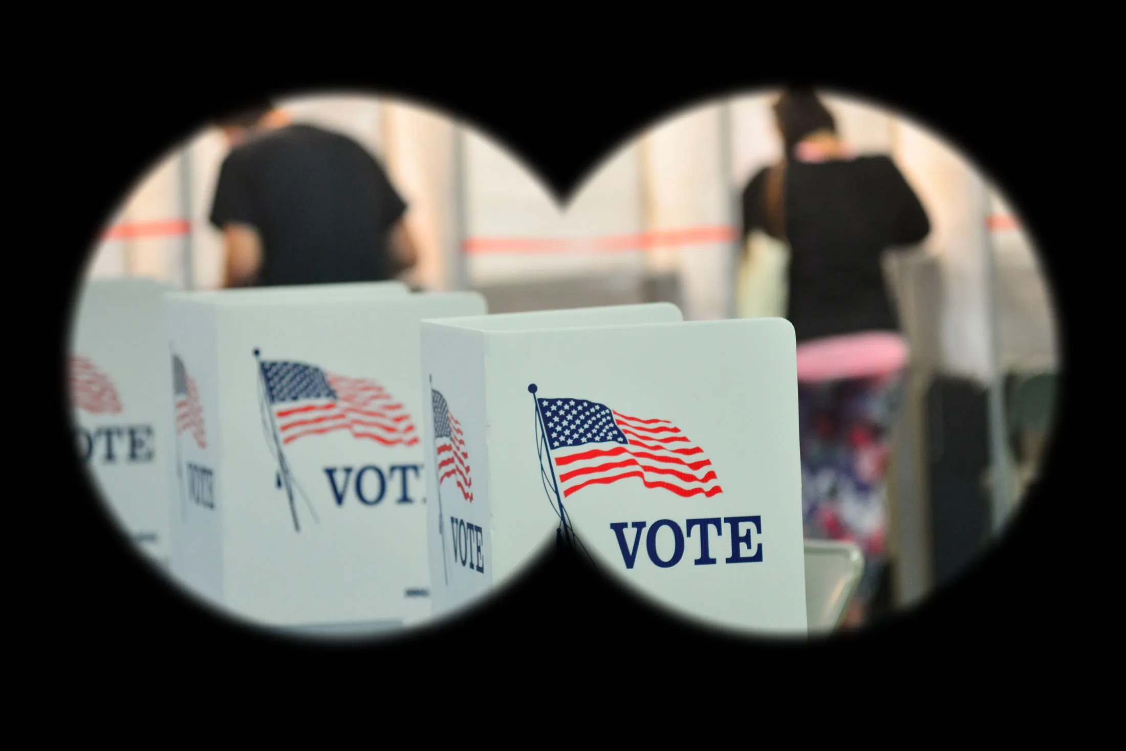 Voting booths are kept socially distant at the Chesterfield, N.H., polling site, which was moved to the gymnasium of Chesterfield Central School from the normal location of the town hall, during the New Hampshire state primaries on Sept. 8.