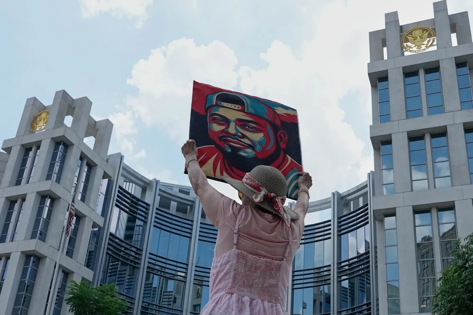 A demonstrator holds a portrait of Kilmar Abrego Garcia outside the federal courthouse in Nashville on&nbsp;June 25.