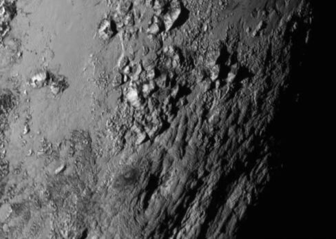 New close-up images of a region near Pluto’s equator reveal a giant surprise: a range of youthful mountains.