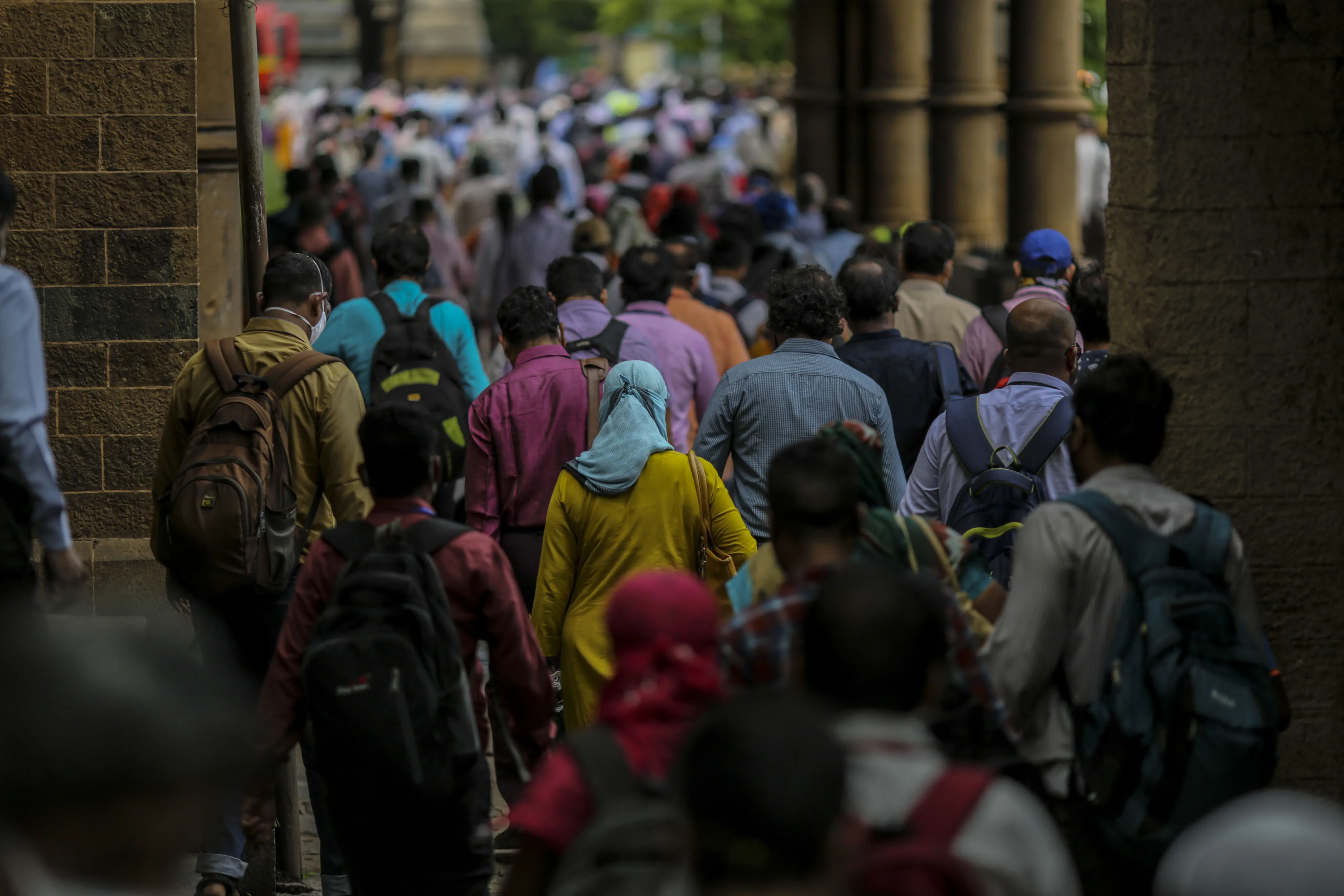 Commuters exit the Chhatrapati Shivaji Maharaj Terminus railway station in Mumbai on&nbsp;July 6.