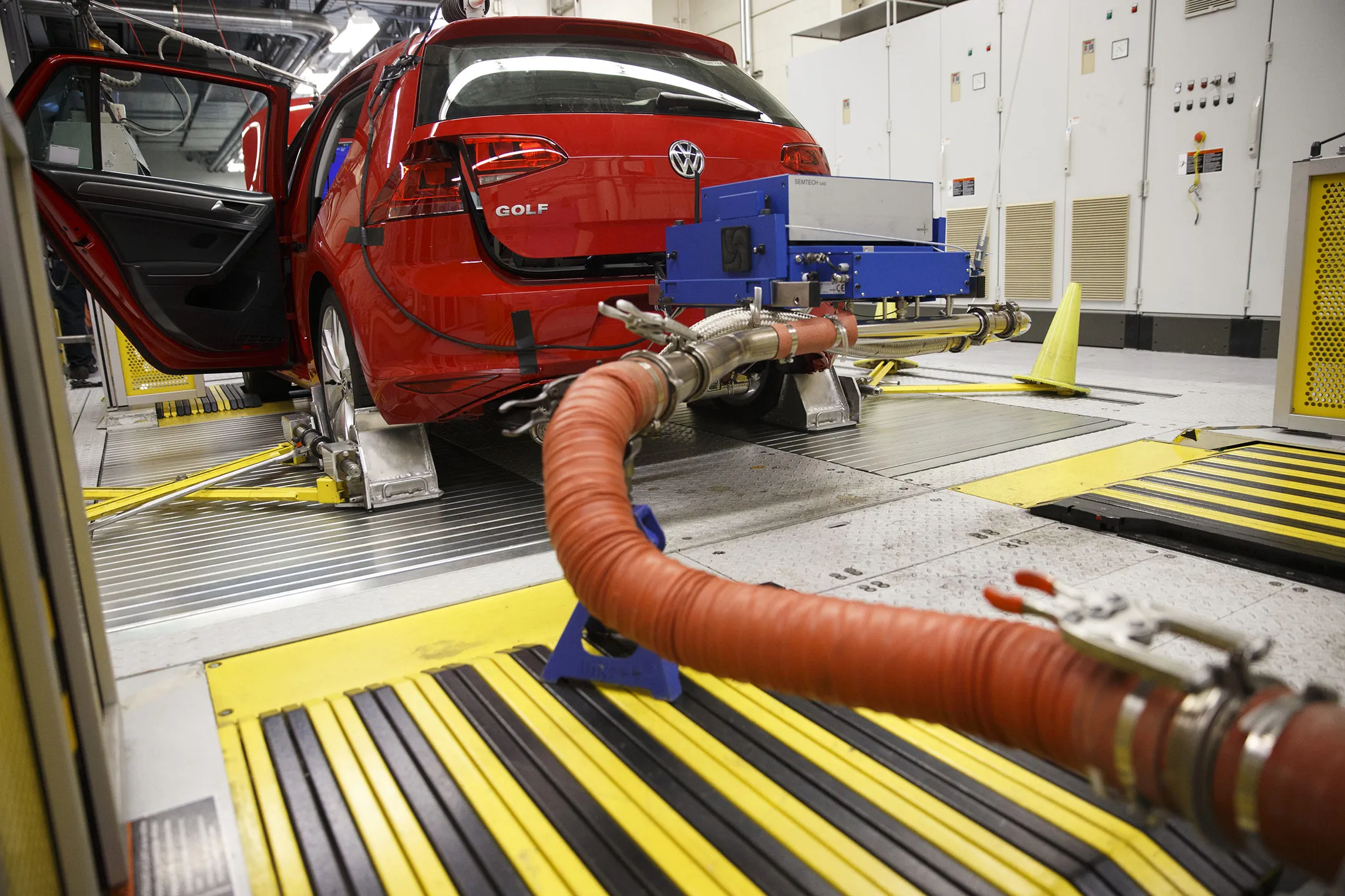 Hoses connect laboratory emission testing equipment to a Volkswagen AG Golf TDI emissions certification vehicle waiting to be tested in California.

