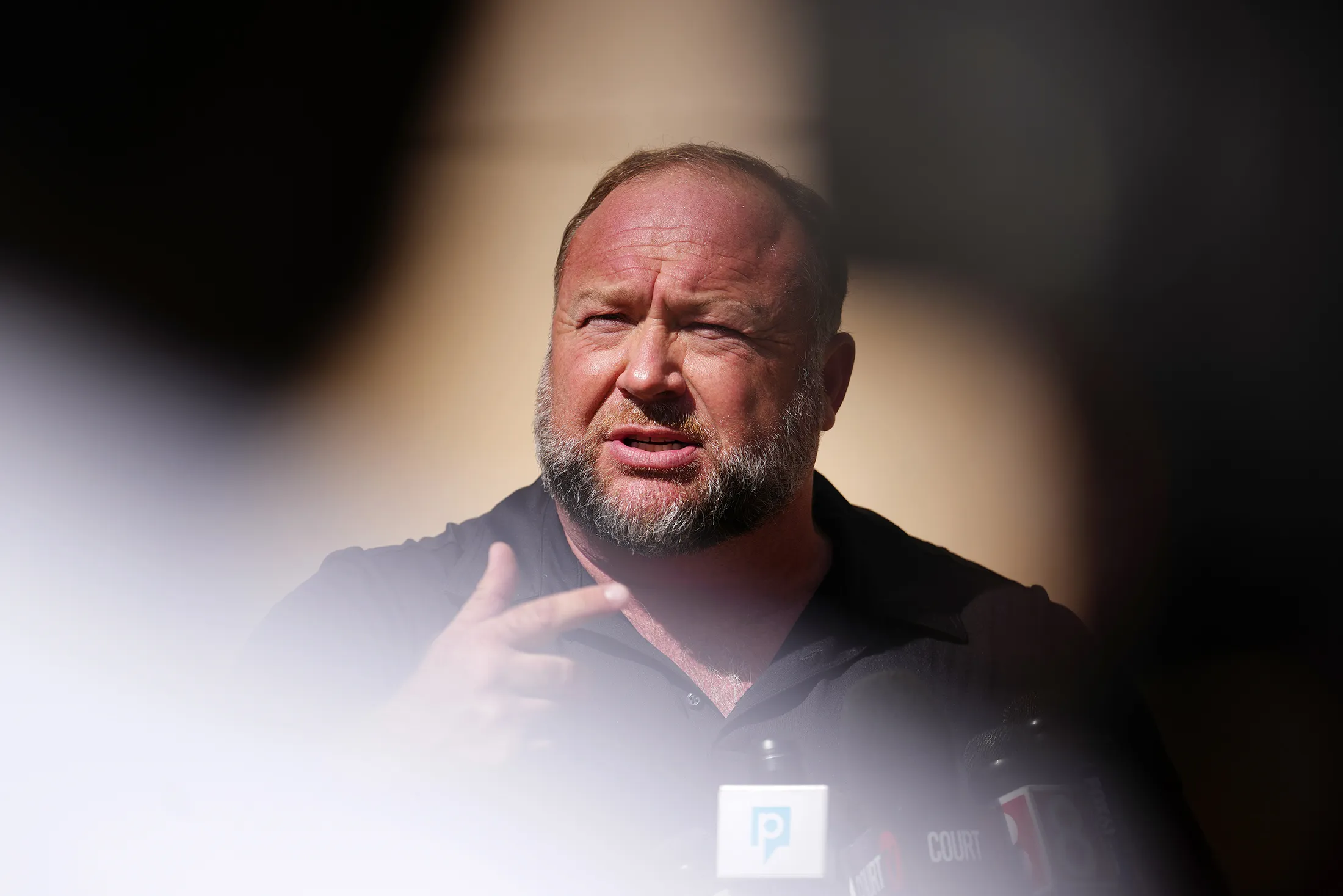 Alex Jones speaks to the media outside Waterbury Superior Court in Waterbury, Connecticut, on Sept. 21.
