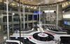 Employees work at the Tokyo Stock Exchange (TSE), operated by Japan Exchange Group Inc. (JPX), in Tokyo, Japan, on Friday, Dec. 29, 2017. Japan’s Topix index capped its best annual performance since 2013, though it ended the last trading day of the year lower as some investors adjusted their positions in thin trading before the New Year holidays.