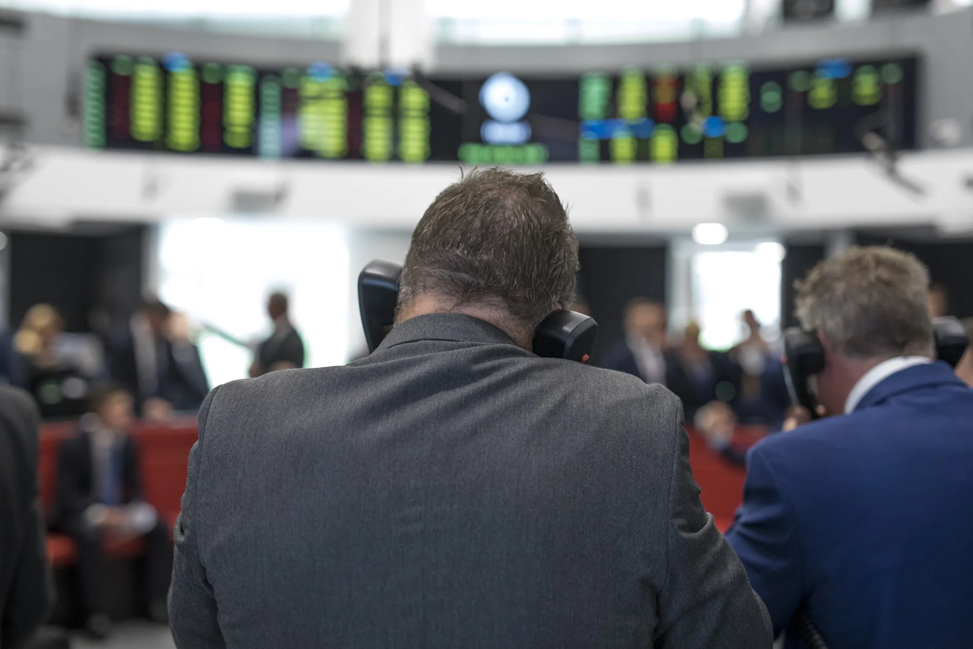 A trader speaks on&nbsp;telephones on the trading floor of the open outcry pit at the London Metal Exchange Ltd. (LME) in London in 2019.