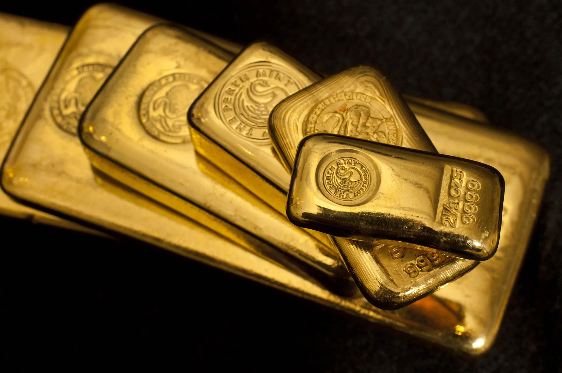 Gold cast bars of varying size at The Perth Mint Australia. 19th July, 2011. Photograph Ron D'Raine/ Bloomberg
