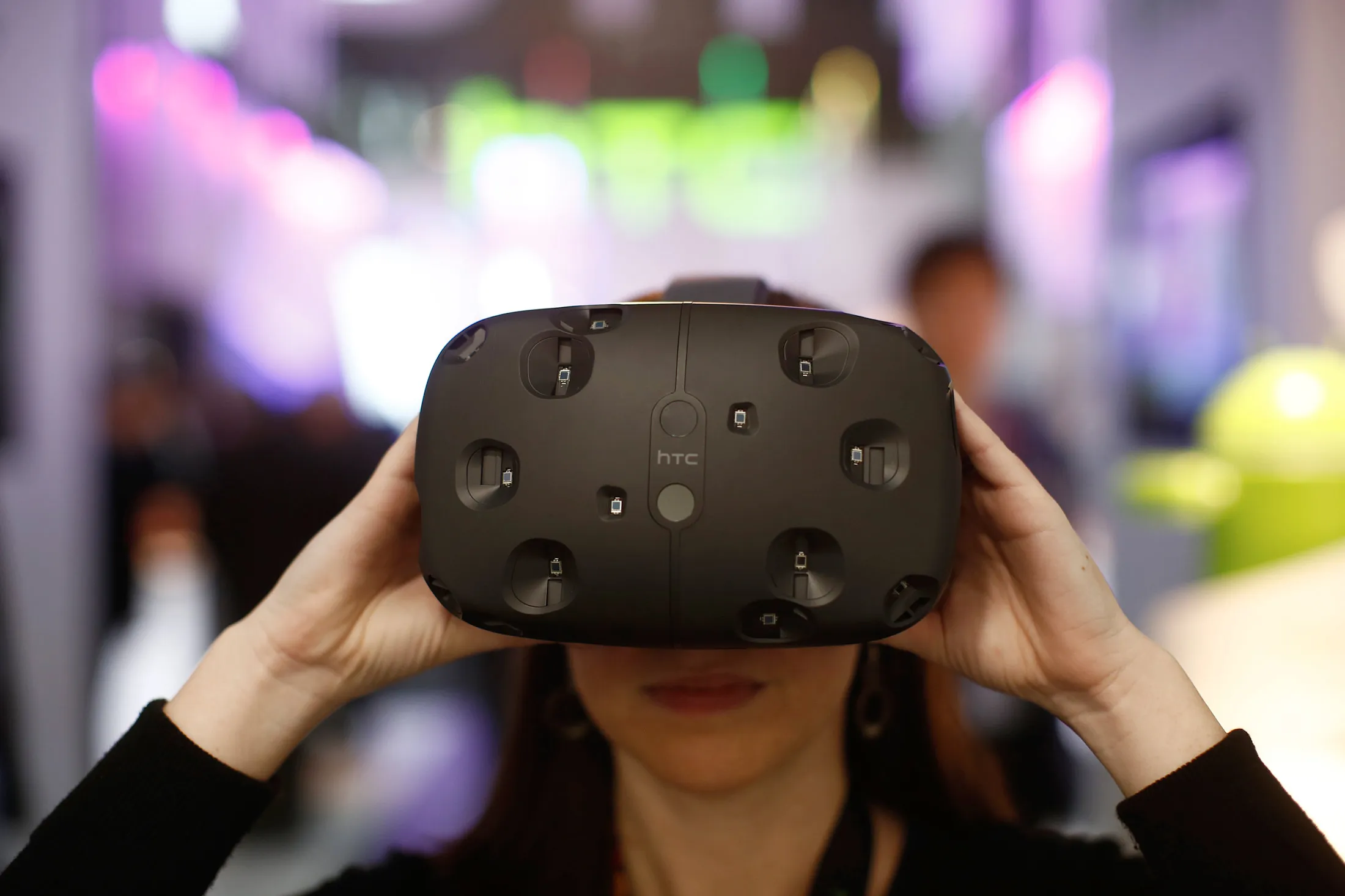 An employee demonstrates an HTC Vive VR virtual-reality headset at the Mobile World Congress in Barcelona on March 3.
