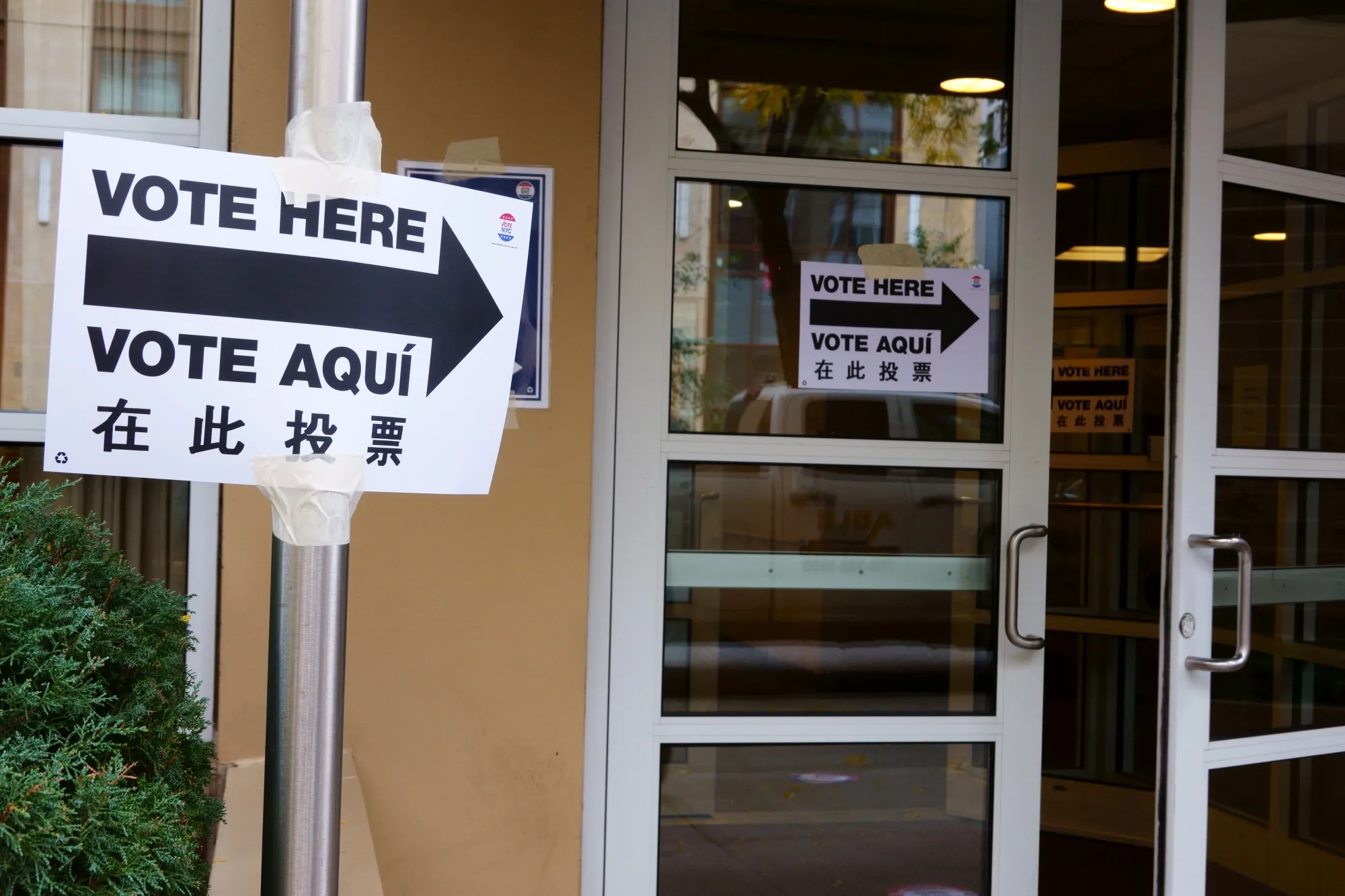 Multilingual signs mark a voting site in&nbsp;Gramercy Park, New York City.