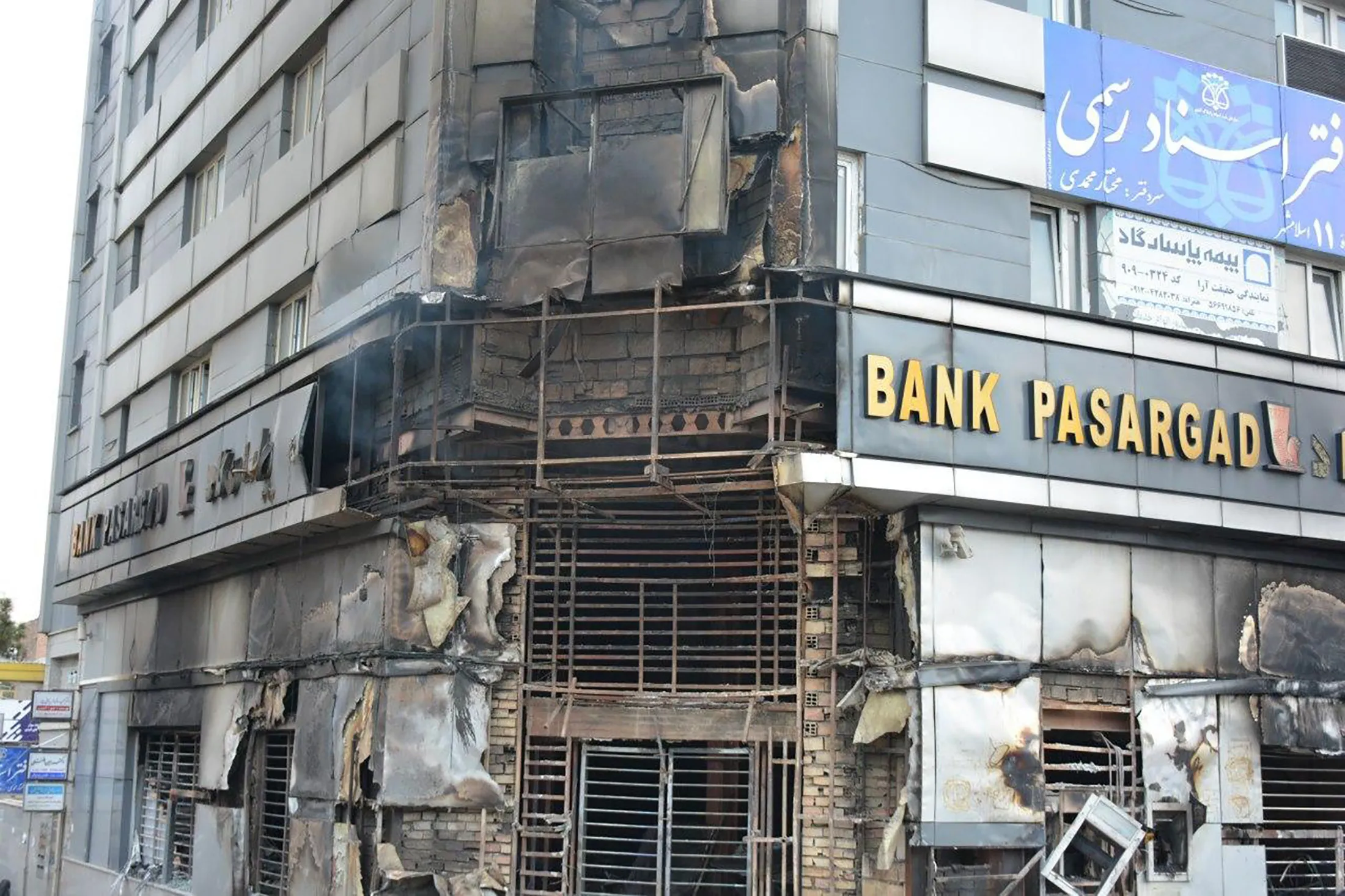 A burned branch of Pasargad Bank in Eslamshahr, near Tehran on Nov. 17.