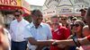 Ben Carson, 2016 Republican presidential candidate, center, greets attendees as he tours the Iowa State Fair in Des Moines, Iowa, U.S., on Sunday, Aug. 16, 2015.
