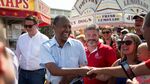 Ben Carson, 2016 Republican presidential candidate, center, greets attendees as he tours the Iowa State Fair in Des Moines, Iowa, U.S., on Sunday, Aug. 16, 2015.