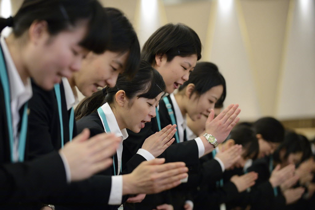 Seven &amp; I Holdings Co. new employees practice sign language prior to an initiation ceremony in Tokyo, Japan.

