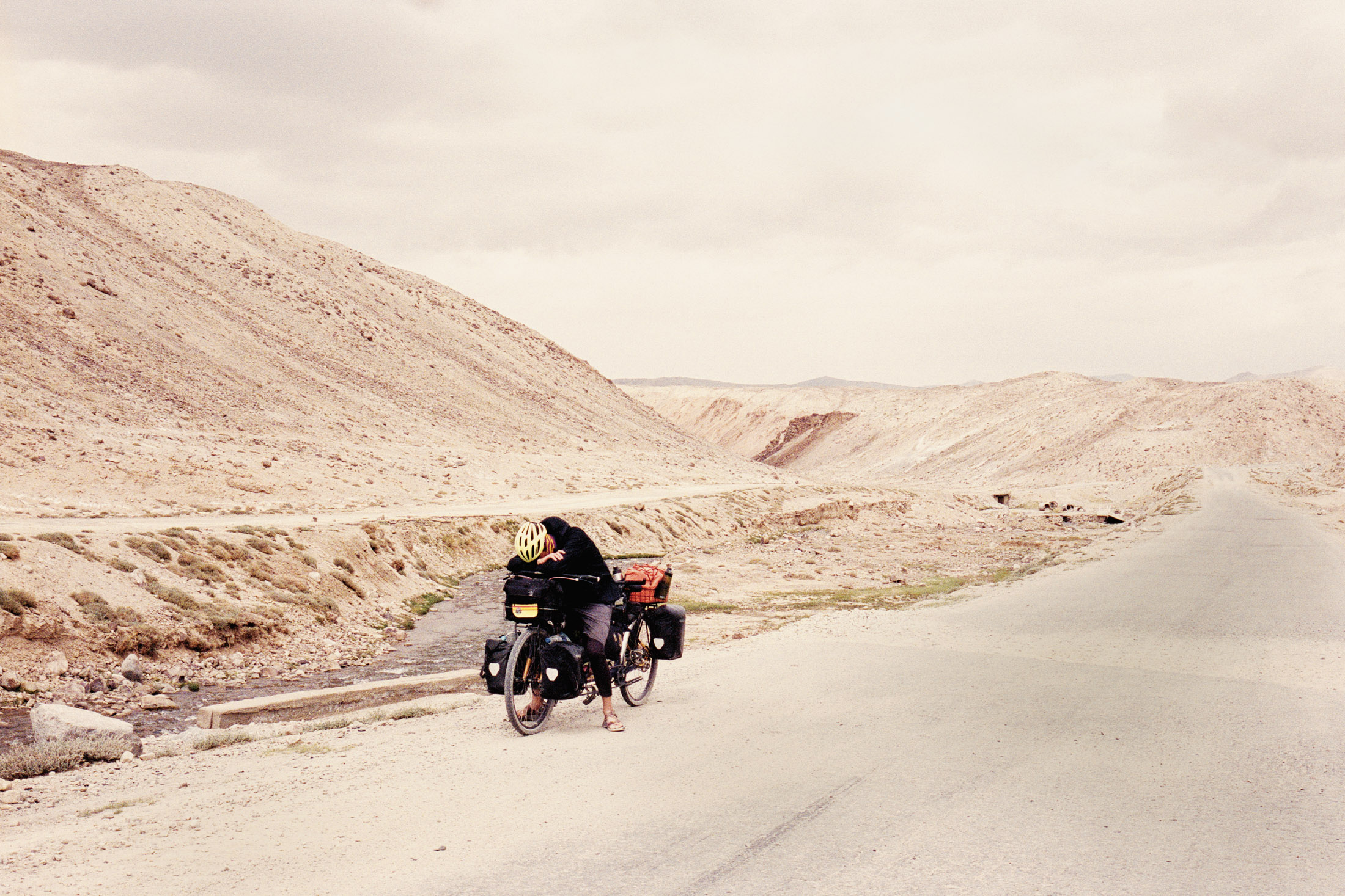 The author’s partner, Hugo, on the Pamir Highway in Tajikistan.